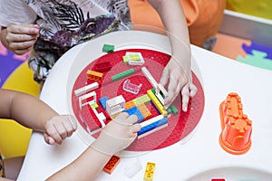 The child collects the Designer. Kids activity in kindergarten or at home