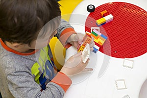 The child collects the Designer. Kids activity in kindergarten or at home