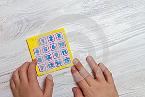 The child collects a puzzle of numbers, the numbers need to be arranged in chronological order