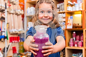 Child with color or paint pigments in store