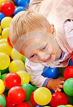 Child in colored ball.