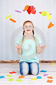 Child with colorful letters