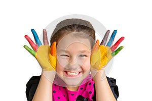 Child with colorful painted palms and hands with color paints.