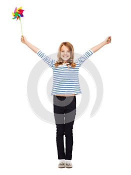 Child with colorful windmill toy