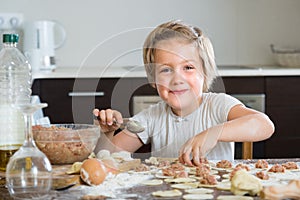 Child cooking meat dumplings