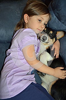 Child and a Corgi