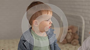 A child with a cough at a pediatrician`s reception