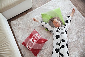 Child in cow print pajamas