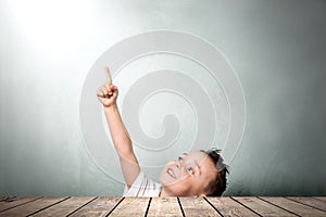 Child crawls out from under the table and looks up