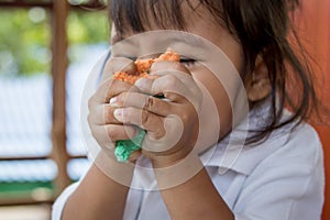 Child cute little girl playing with clay, play doh