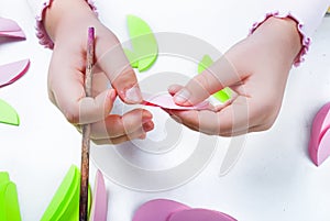 Child cuts an eggs for Easter out of paper