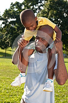 Child on dad's shoulders