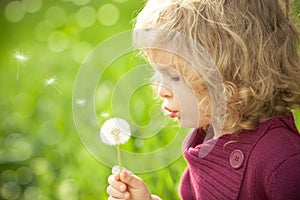 Child with dandelion