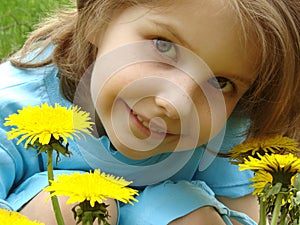 Child with dandelions