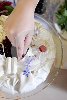 Child decorating a cake