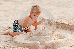 Child destroy sand castle.