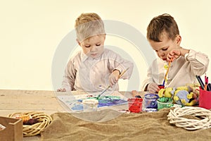 Child development. Easter egg, children in bunny ears, brothers with eggs.