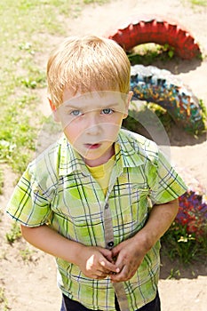 Child with dirty face and hands outdoor