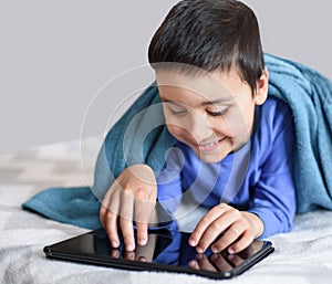 child on distance learning. technology, people and lifestyle, distance learning, online education concept. happy kid with tablet