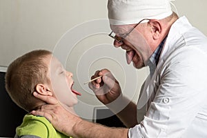 The child doctor examines the patients in his office. Happy children are very fond of a good pediatrician. The concept of a home d