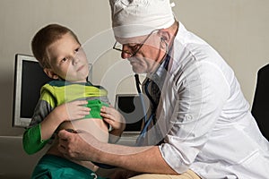 The child doctor examines the patients in his office. Happy children are very fond of a good pediatrician. The concept of a home d