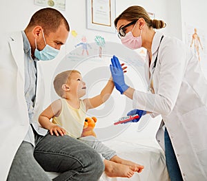 child doctor hospital patient medical nurse medicine health woman boy mask corona virus epidemic care healthcare