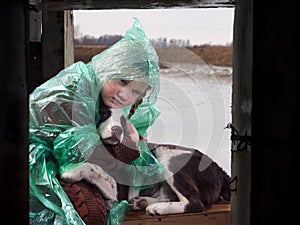 A child and a dog in a flood disaster area