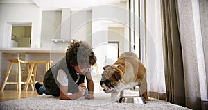 Child, dog and food feeding of a kid and pet together for a morning treat with breakfast. Happiness, floor and funny