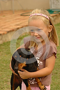 Child with dog pet