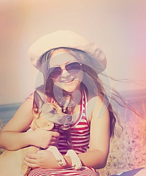 Child and dog and sea