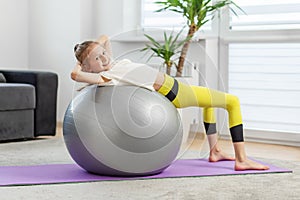 Child Doing Back Stretch on Fitness Ball