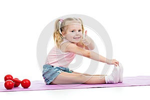 Child doing exercises and showing thumb up