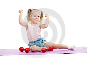 Child doing exercises with weights