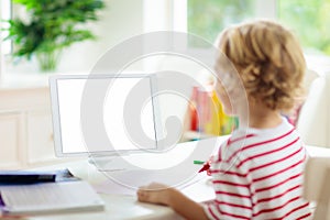 Child doing school homework. Online learning