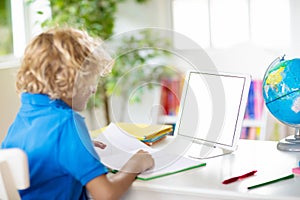 Child doing school homework. Online learning