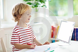 Child doing school homework. Online learning