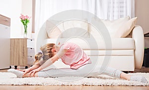 Child doing stretches at home