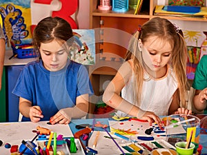 Child dough play in school. Plasticine for children.