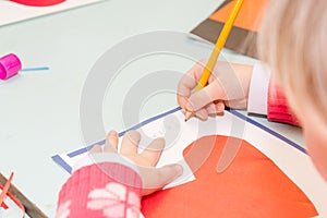 Child draw a postcard. Children are engaged in needlework. The girl signs a postcard on 14 February.