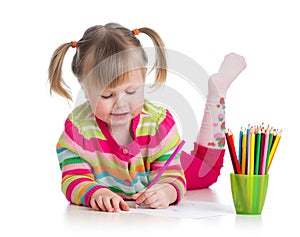 Child drawing with colourful pencils