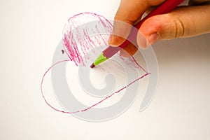 Child drawing heart on white background baby fingers