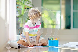 Child drawing. Kid painting rainbow