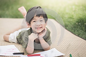 Child drawing picture with crayon