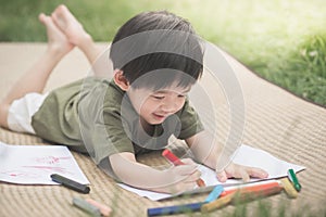 Child drawing picture with crayon