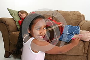 Child drawing on teenager