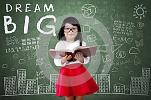 Child with Dream Big text in class