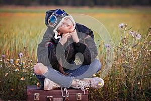 Child dreaming of travel vacation or holidays