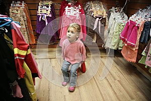 Child in dress shop