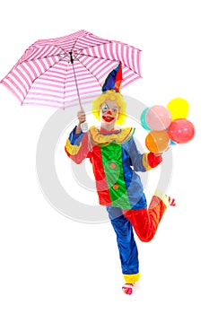 Child dressed as colorful funny clown