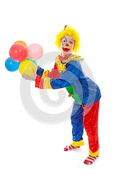 Child dressed as colorful funny clown